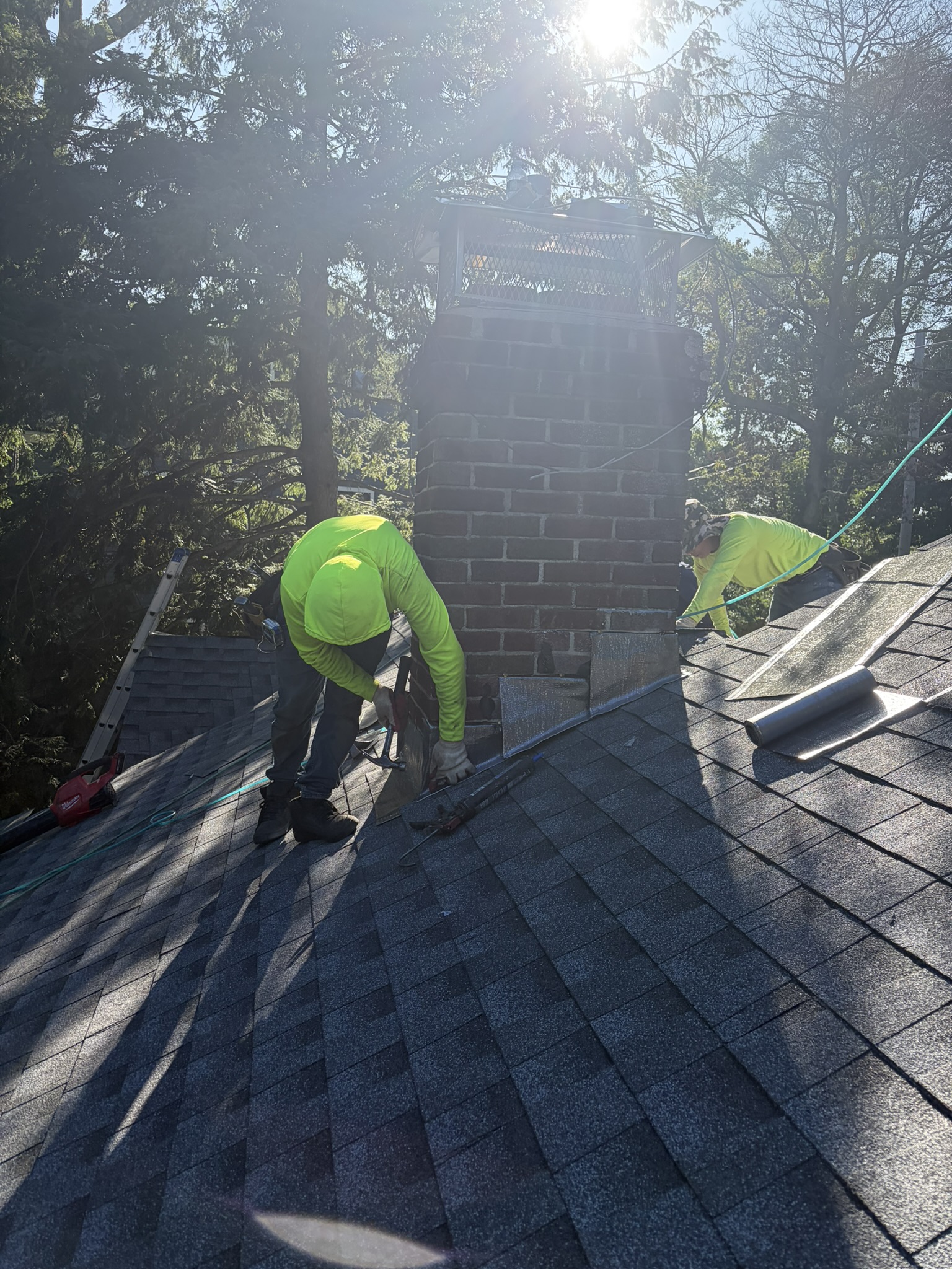Roofer on roof during Red Sky Construction roofing project, Greater Boston MA